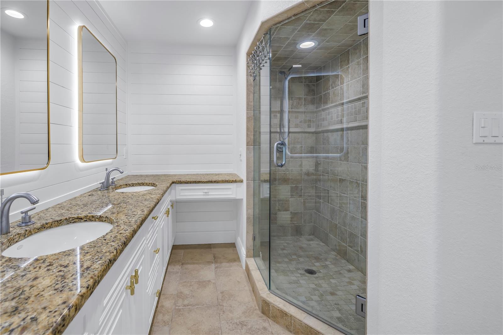 Primary bath with walk in shower and vanity area