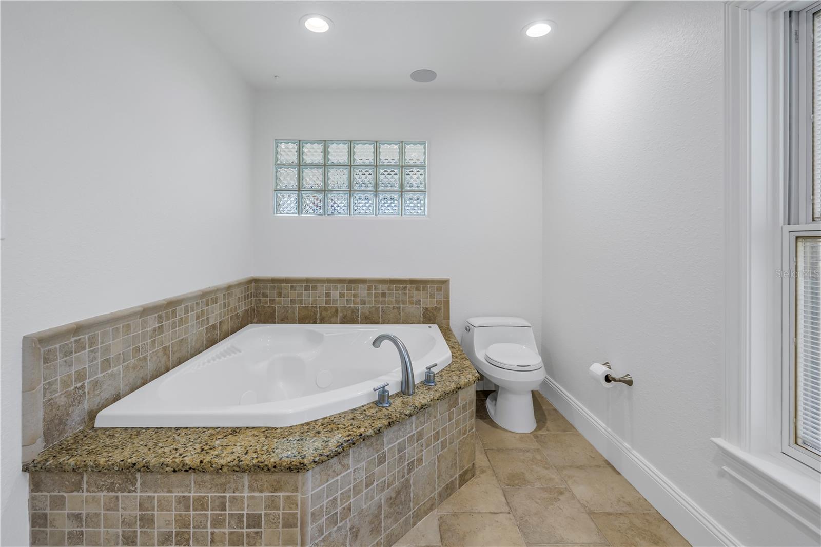 Primary bath with Jacuzzi soaking tub