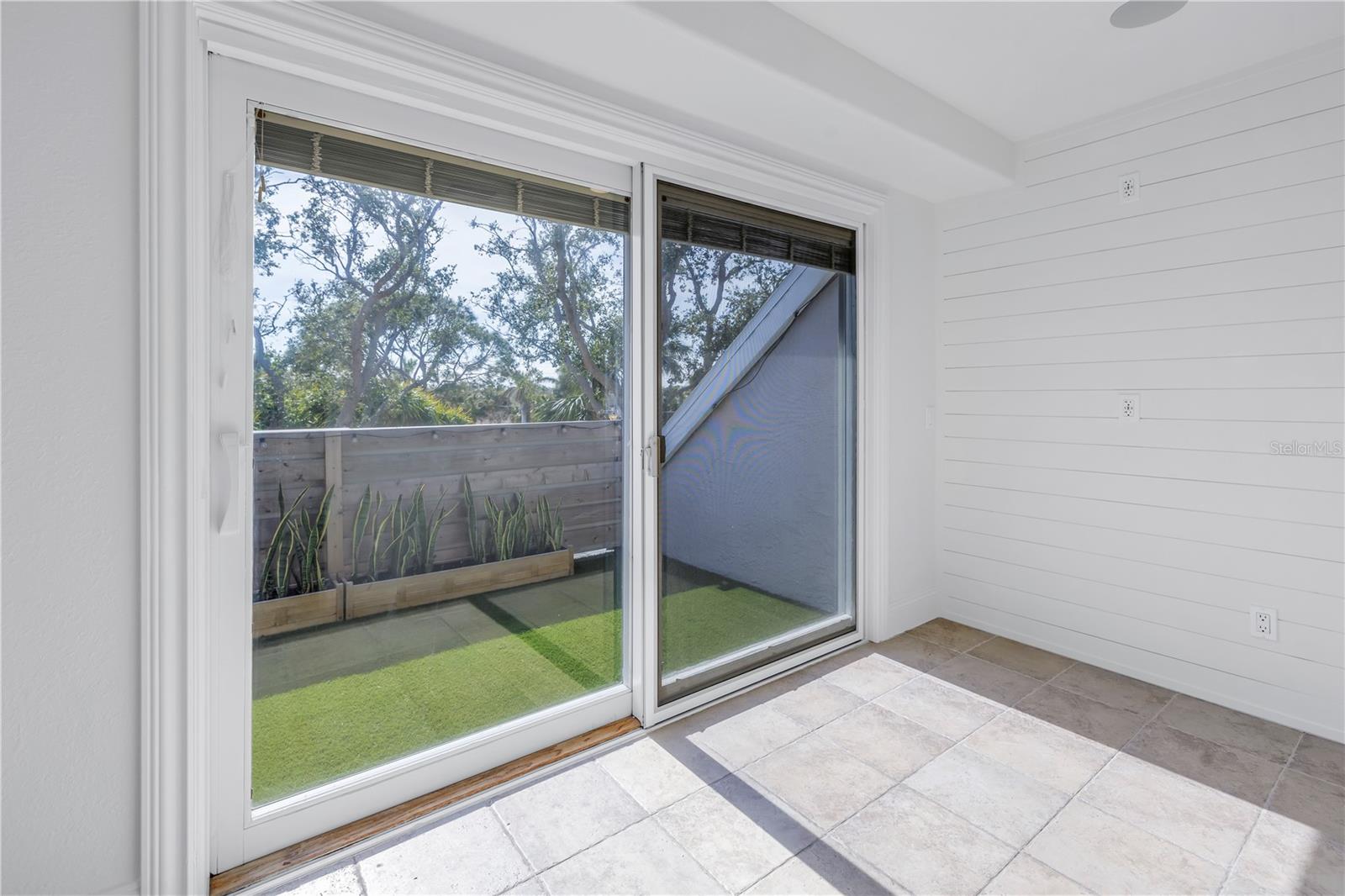 There is additional space in the laundry room which can have many uses, sliding doors lead to a private balcony