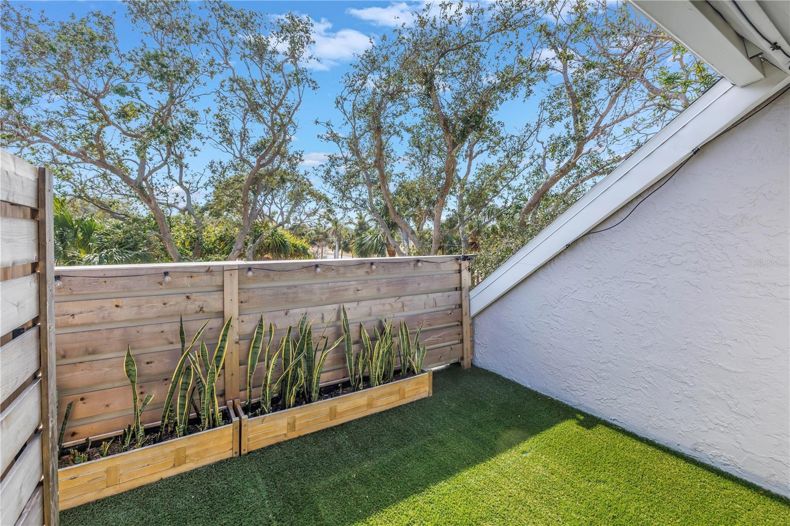 Relaxing balcony with planter boxes