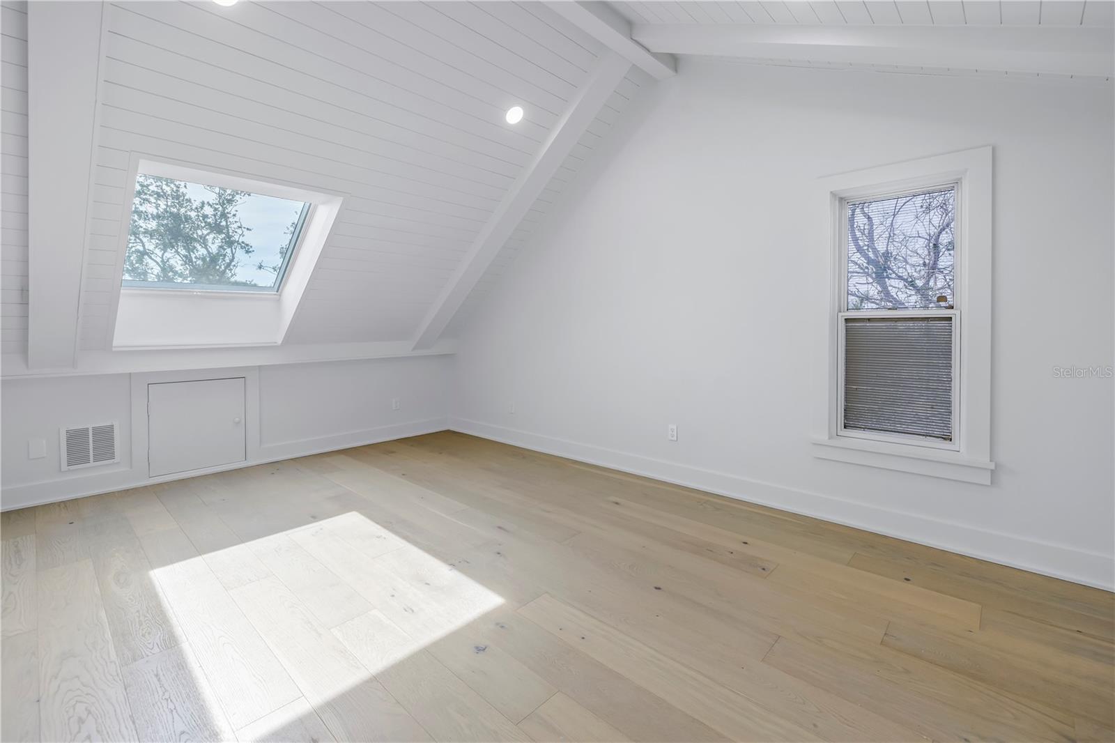 Third bedroom with skylight, engineered white oak flooring