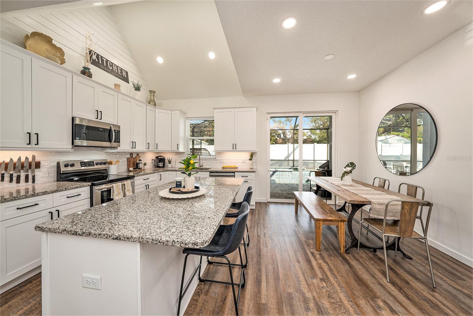 Kitchen-Dining area leading to screen in backyard