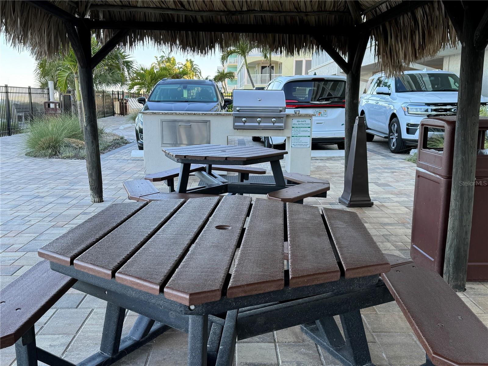 Picnic tables under Tiki