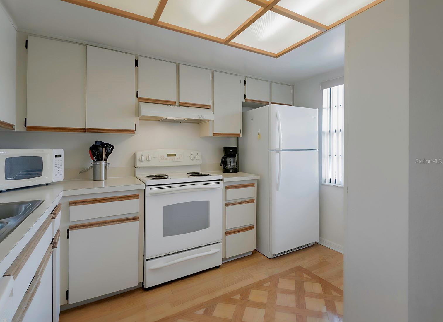 Wood inlay kitchen floor.