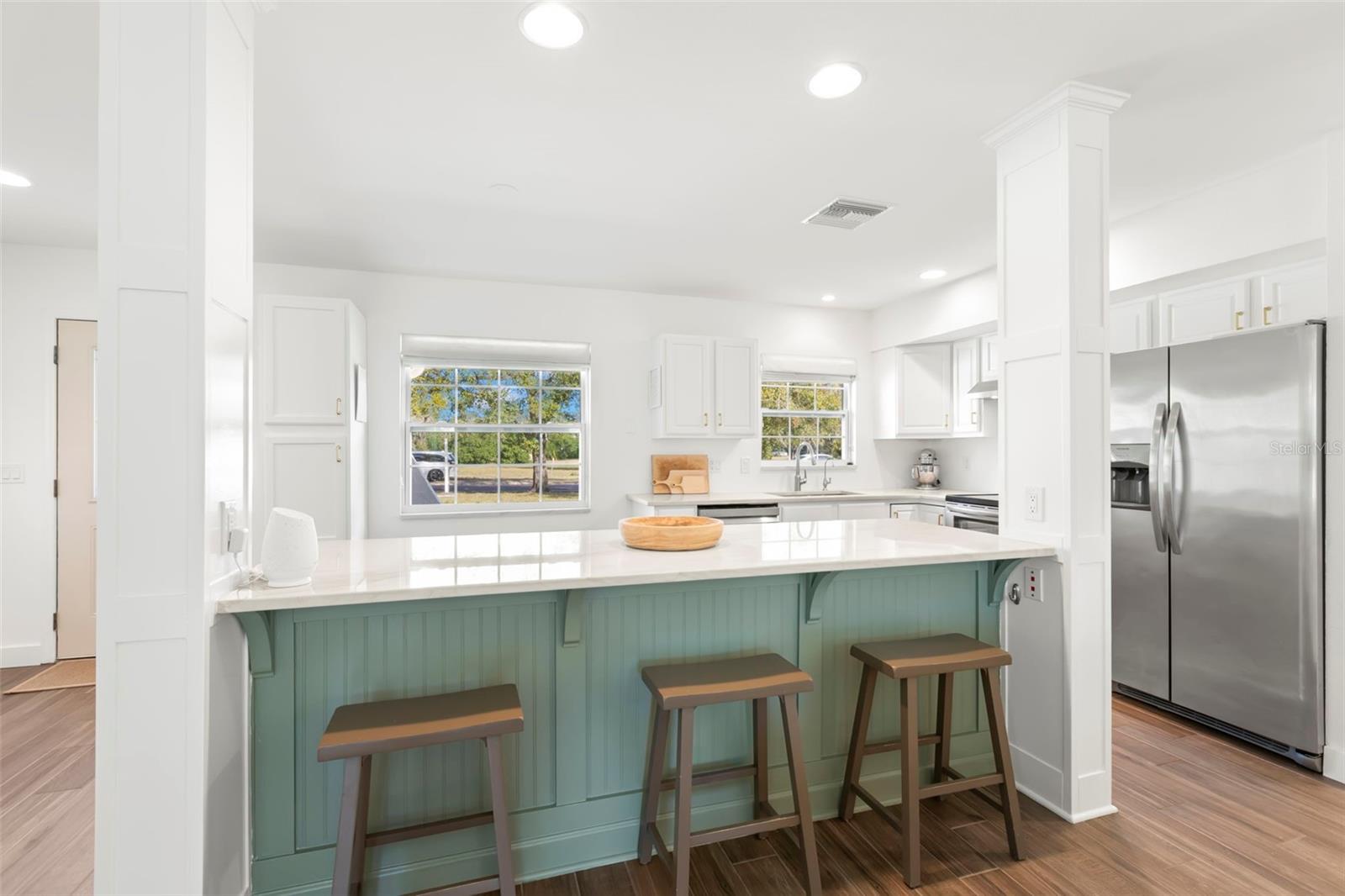 Kitchen showcasing the island and seating.