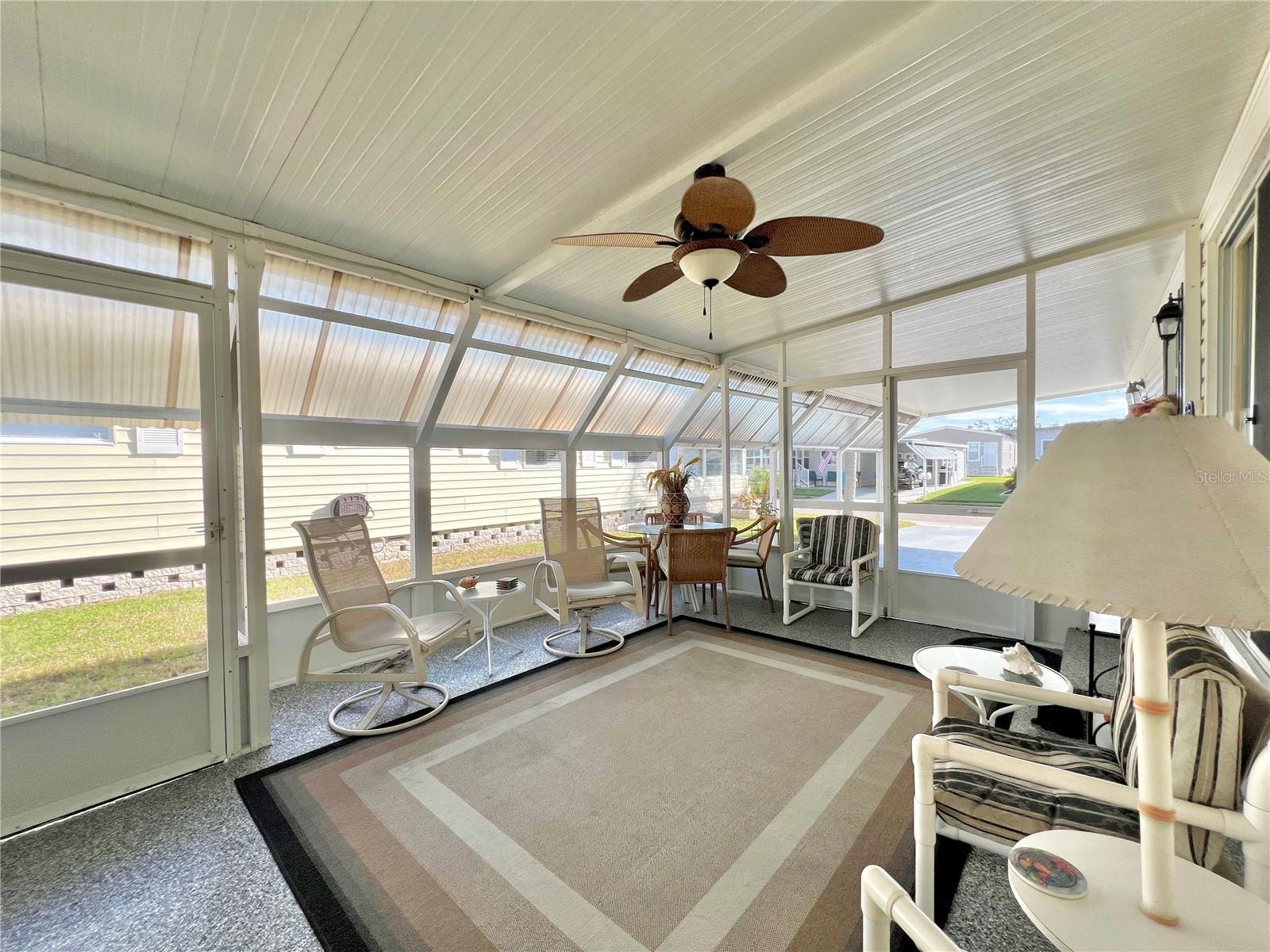 Enclosed screen patio under carport