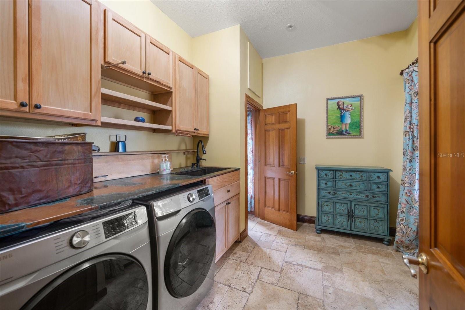 Laundry Room With Sink and Bronze Countertops