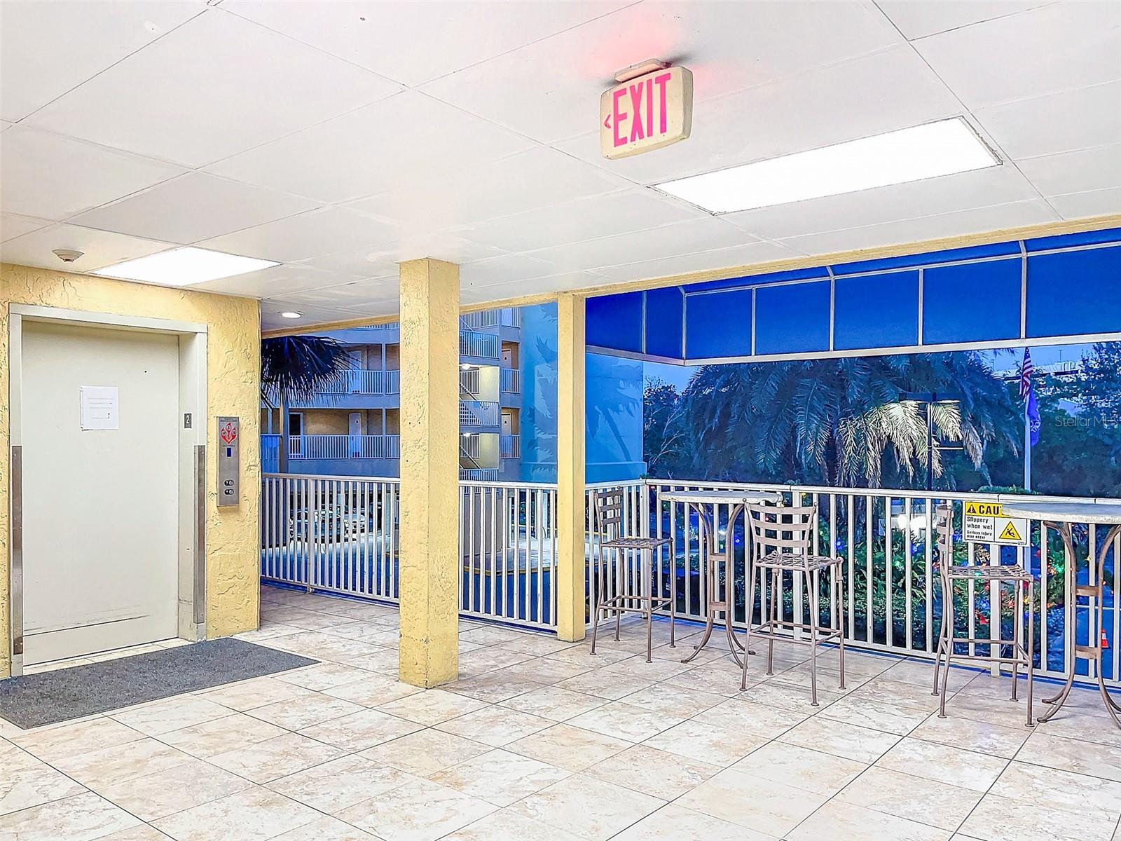 Elevator leading to front office / Hallway to Unit 208