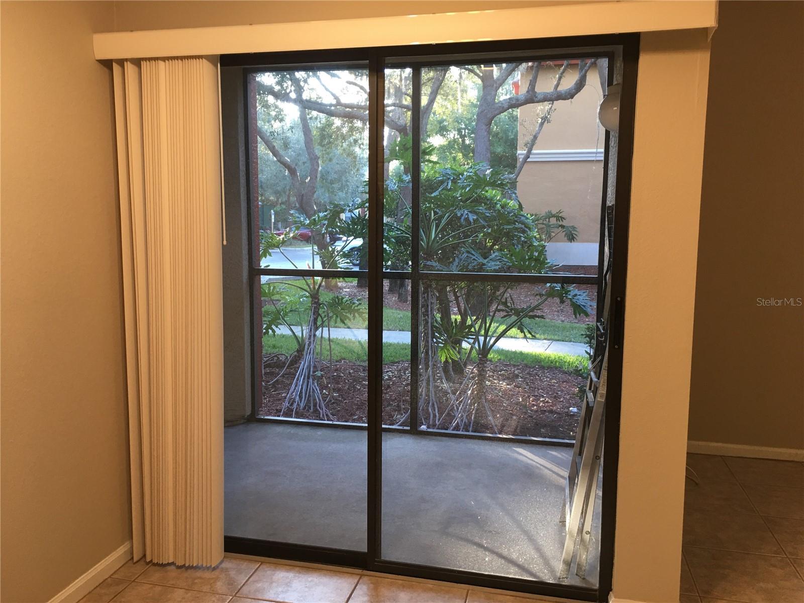 Screened in patio by Dining area