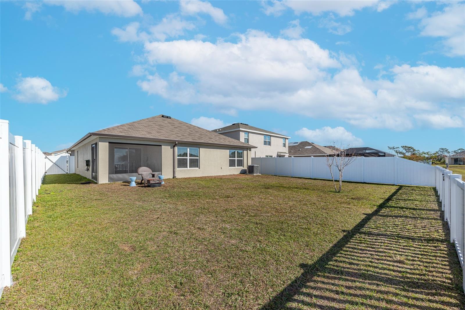 There is a large fenced in yard with 2 gates but the fence along the back water feature is lower and has slats so the view is not obstructed.