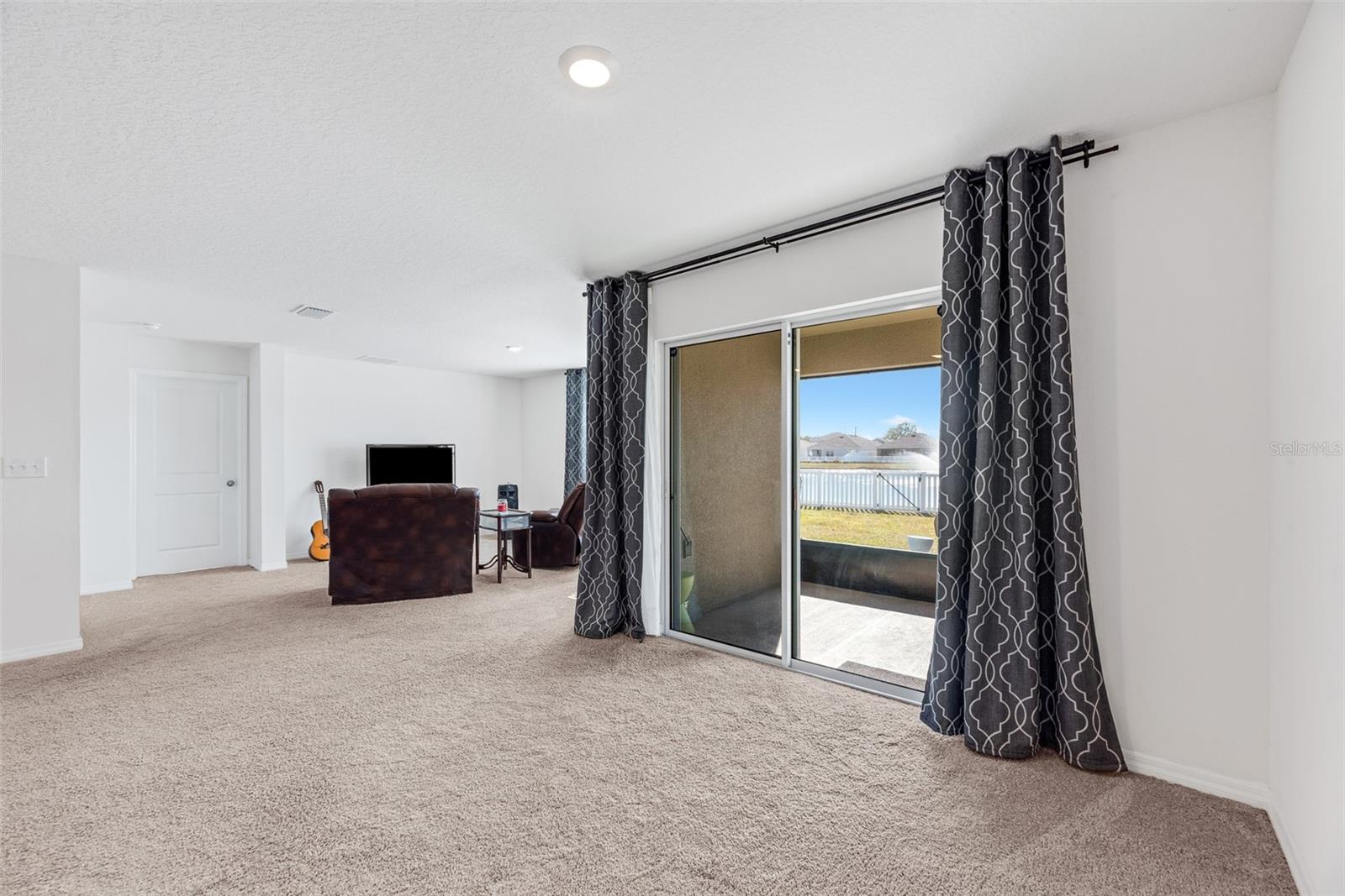 Sliding door from dining area to screened lanai.