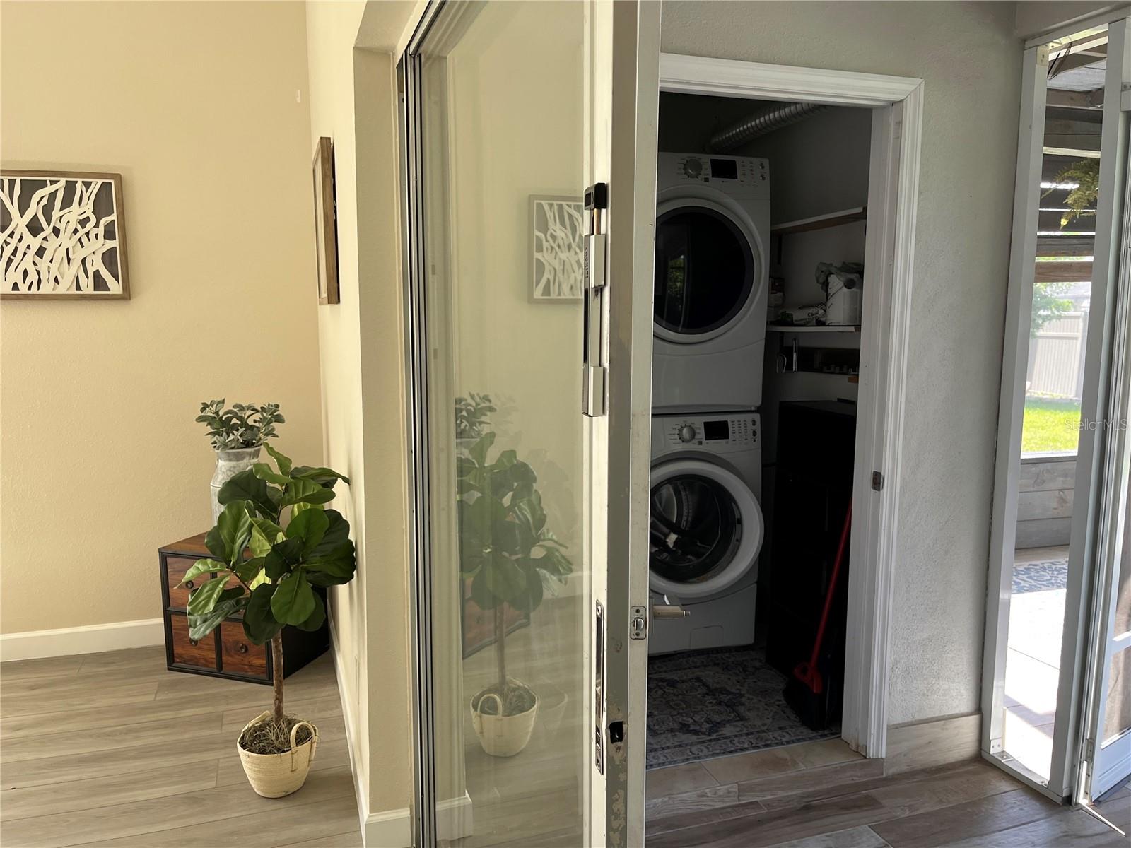 Sliding door to enclosed patio with laundry room