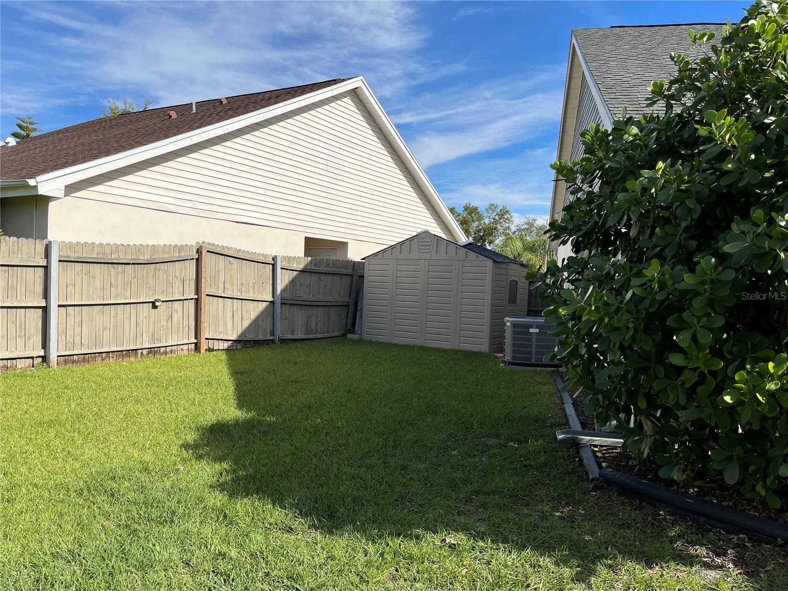 Backyard view with storage shed