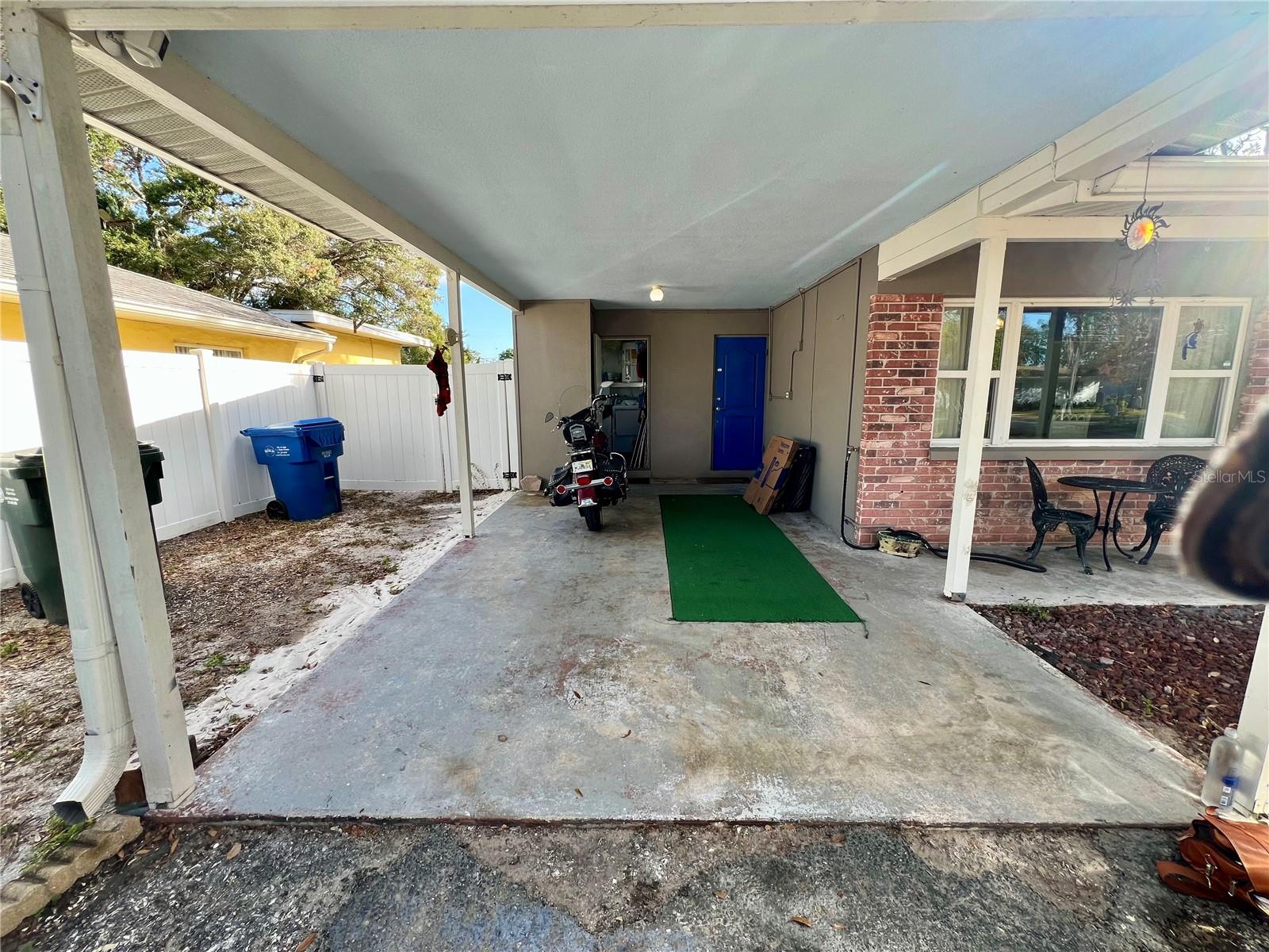 Carport with laundry area and storage