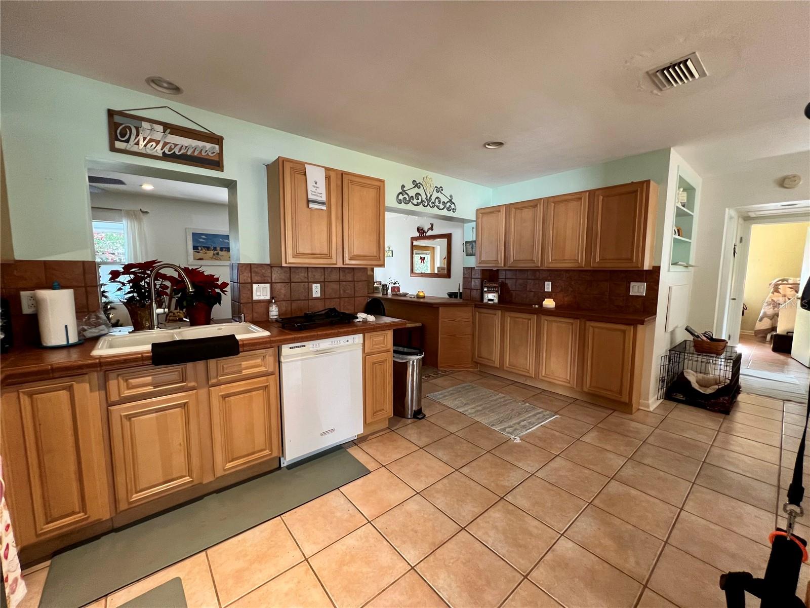 Kitchen with built in storage wall