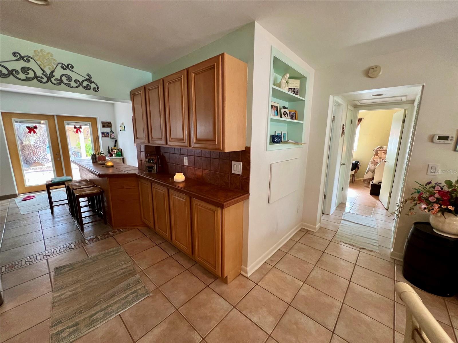 Kitchen with built in storage wall