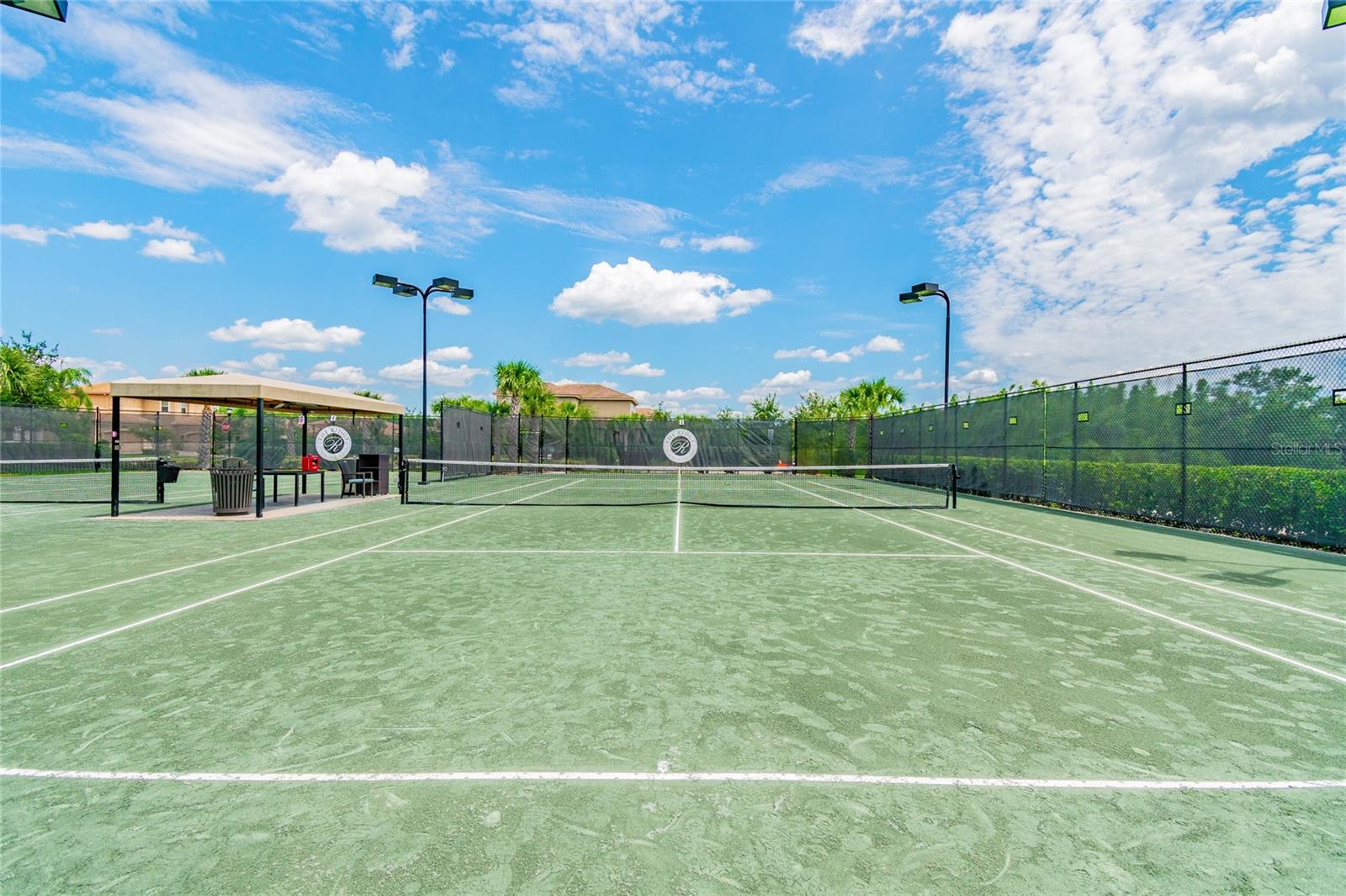 Clay tennis courts with lights