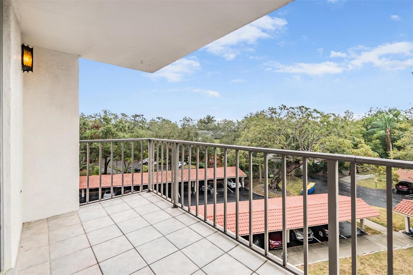 Smaller balcony off glass sliders in the dining area