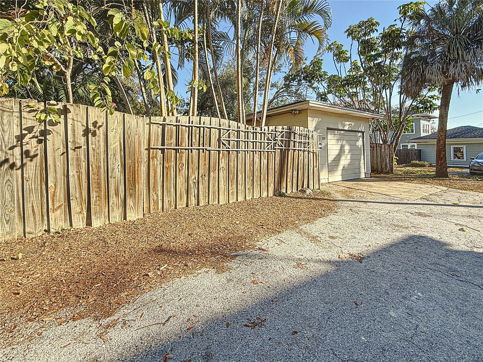 Rear - fence and garage on alley