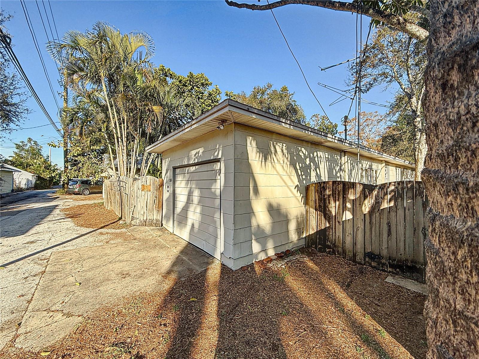 Rear - garage on alley, and gates to east-side patio and west-side yard