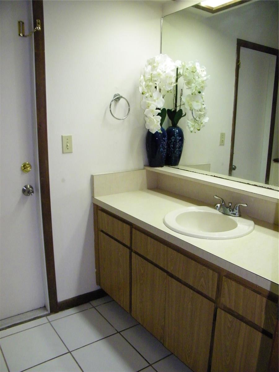 Hall Bathroom with door to pool