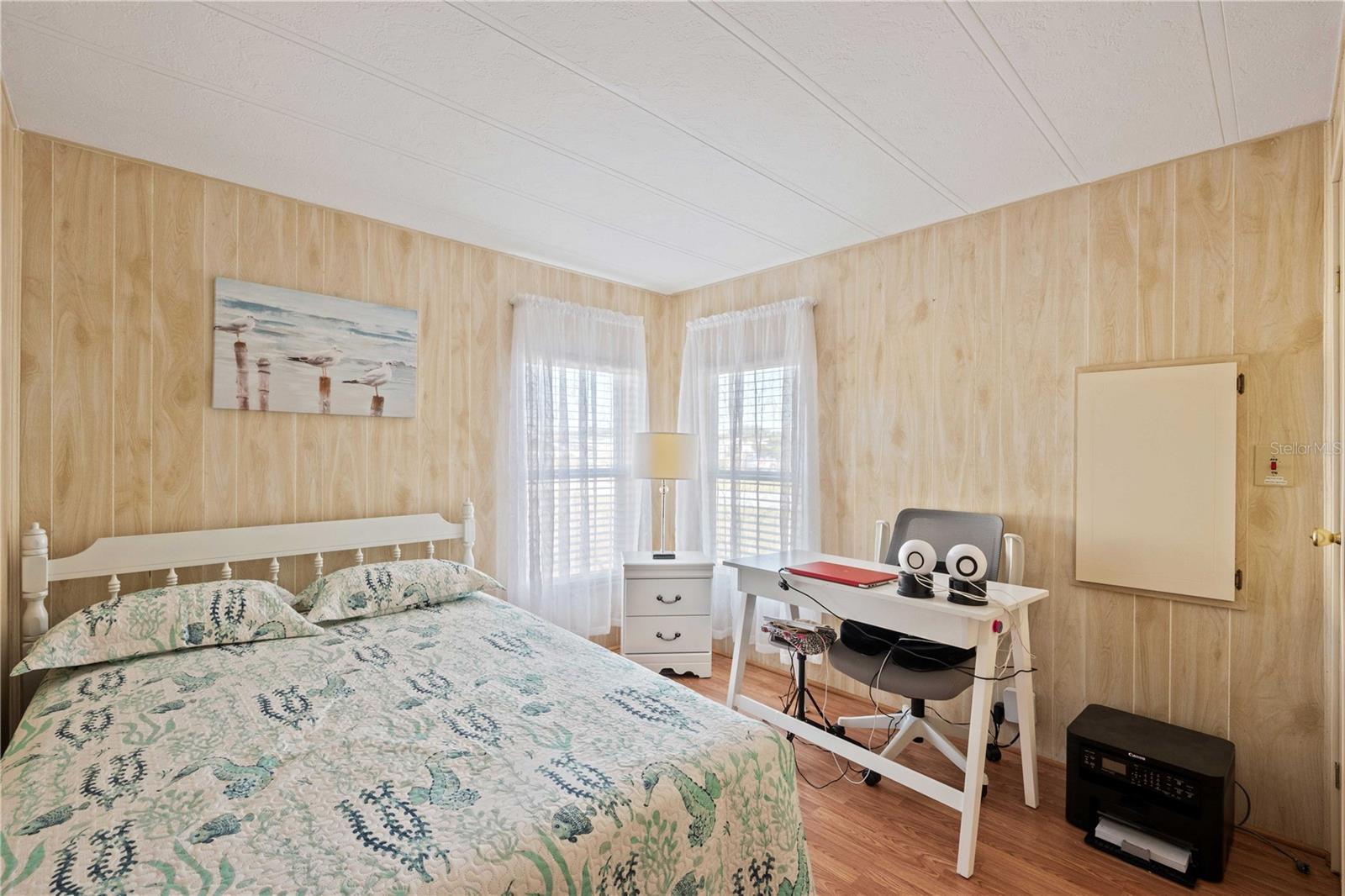 What a lovely guest bedroom with corner windows