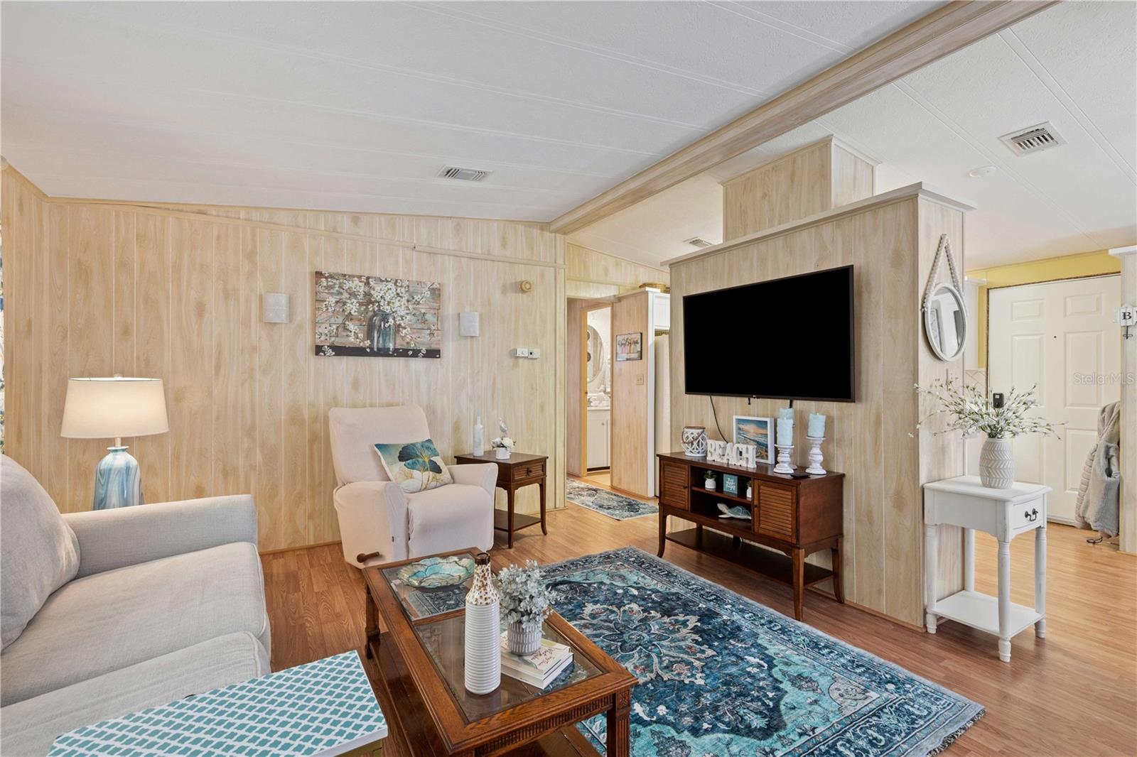 Living room opens to dining area