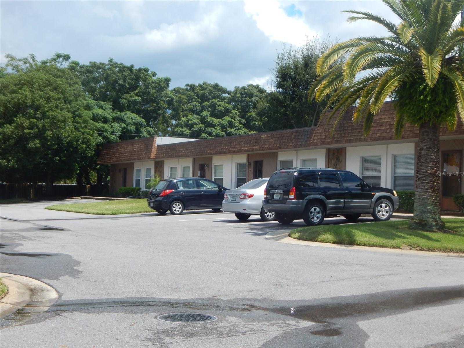 Exterior view of building. Unit is at far end.