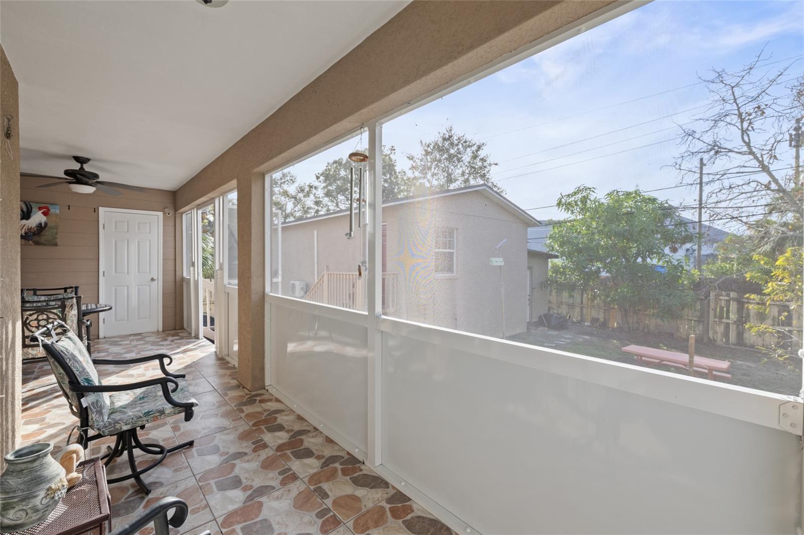 Rear Screened Patio w/ view of rear efficiency/bedroom private entrance