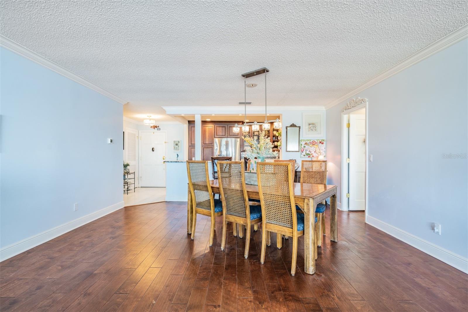 Large Dining Table area with Engineered Hardwood Flooring