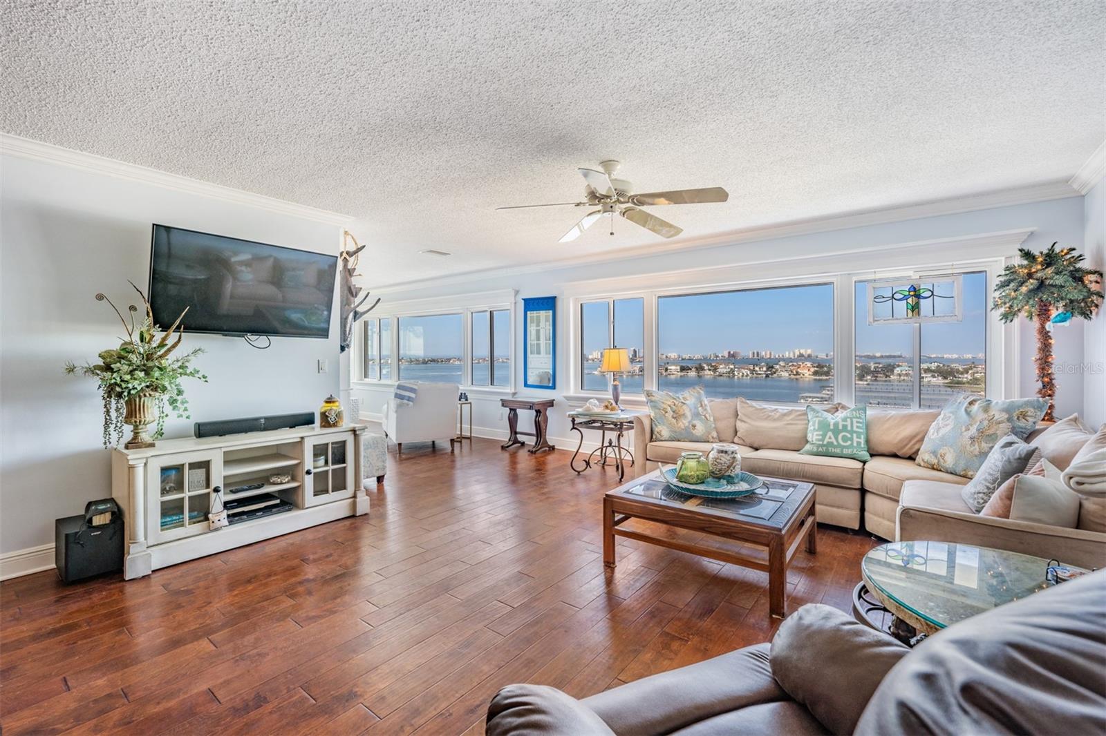 Family Room with Crown Molding, Ceiling Fan and Cased Windows - so much natural light coming in and the views are stunning!