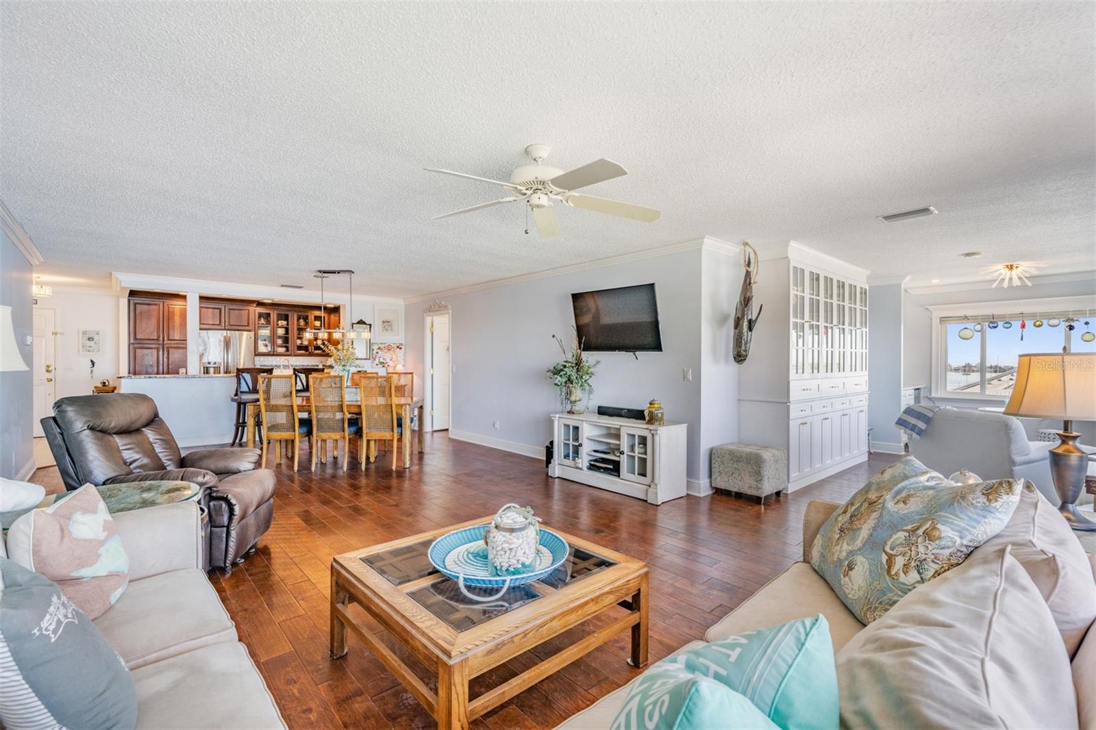 Full View of the Spacious Family Room/Dining Room and Sitting Room with built ins and wet bar.