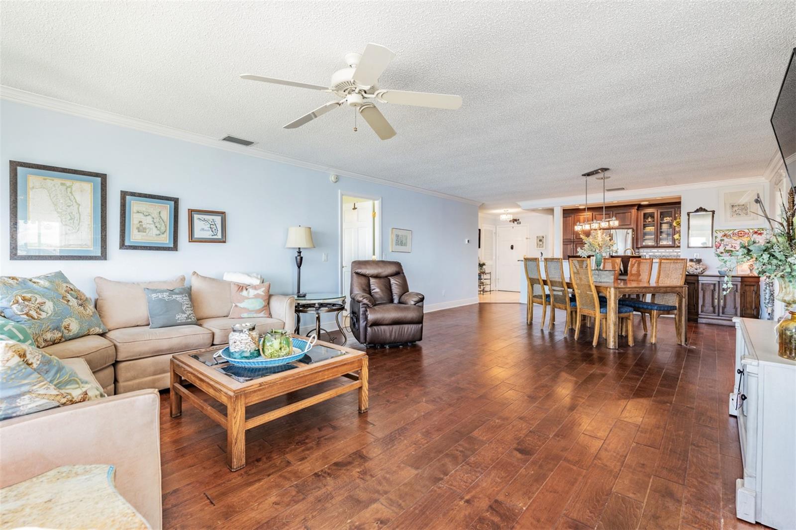 Open View of the Spacious Family Room/Dining Room, ceiling fan, crown molding.