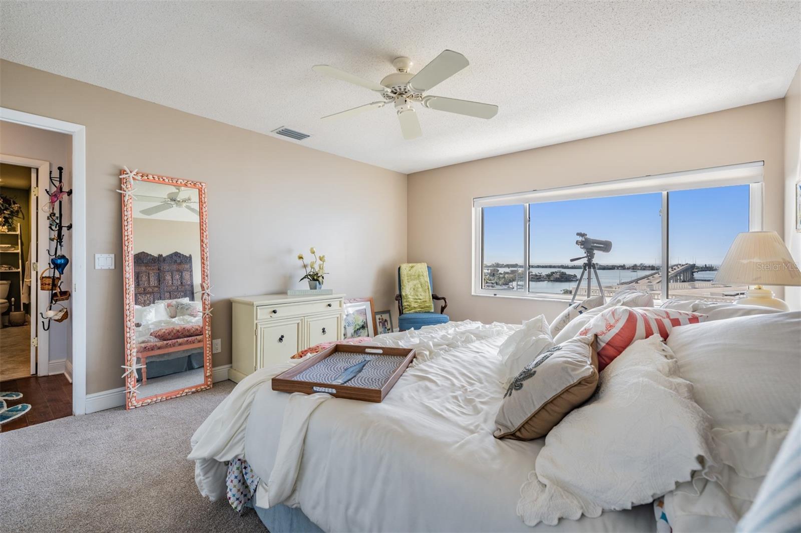 Guest Bedroom, stunning water views, new carpet and a ceiling fan.