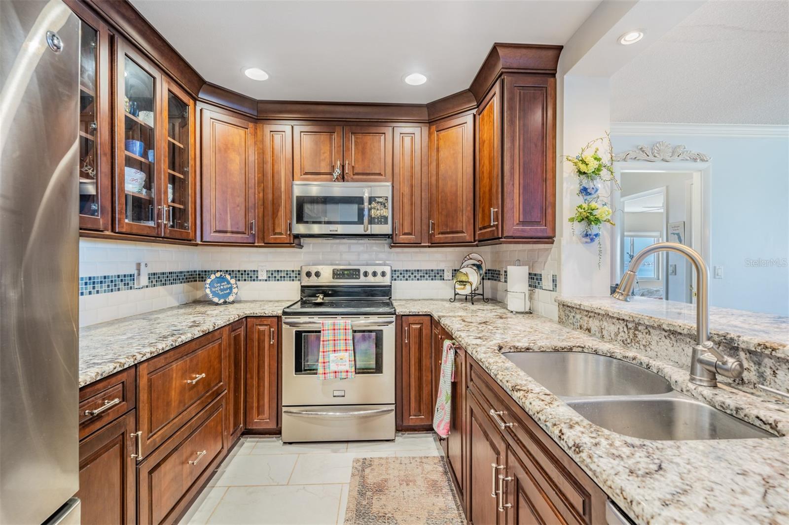 Updated and Open Kitchen to the Dining Room and Family Room.  Granite Countertops, Stainless Steel Appliances and Inset Lighting.