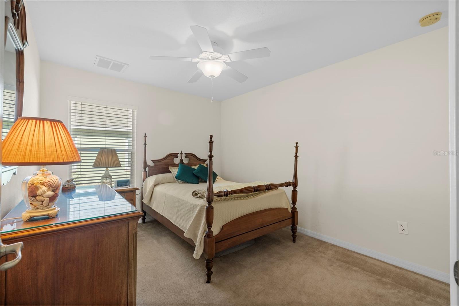 Guest Bedroom with built-in closet and ceiling fan.