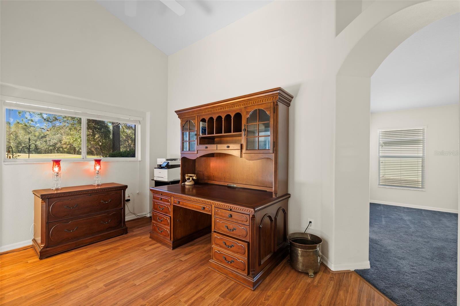 The office is attached to the primary bedroom and screened-in porch.