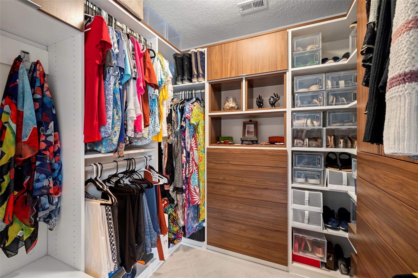 2 six foot by 6 ft walk in closets with California Closet customized closets