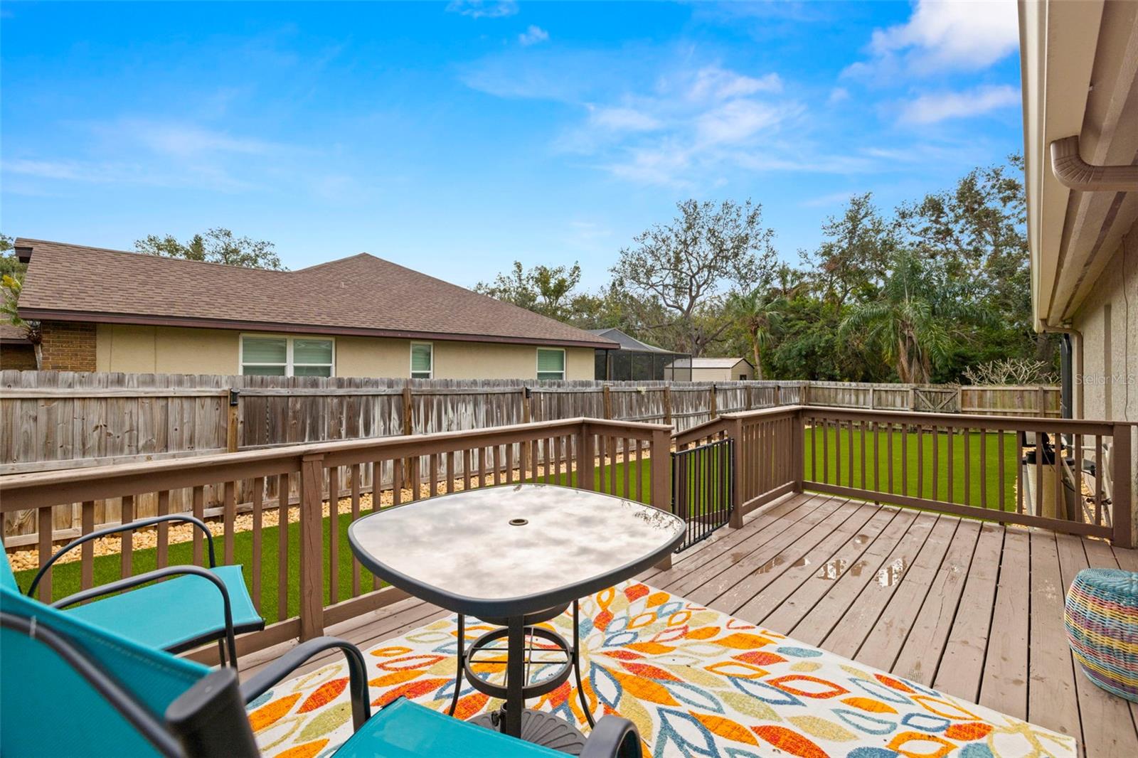 Walk off the Primary bath to this private deck and artificial turf - perfec dog run