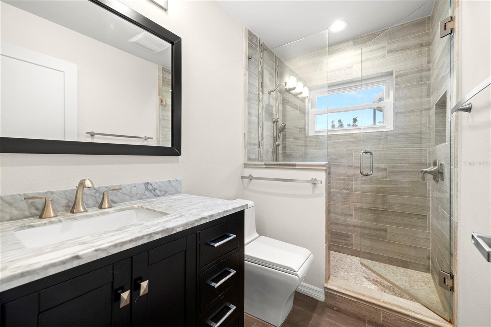 Hall Bathroom updated with quartz vanity and updated shower