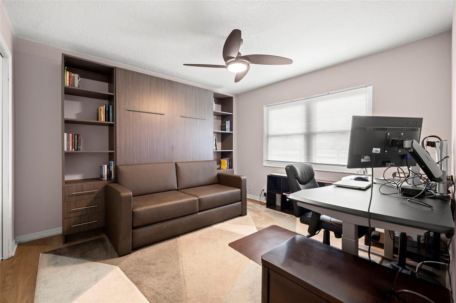 Bedroom #3 with Queen Murphy bed that stays with functional couch that transforms when sleeping