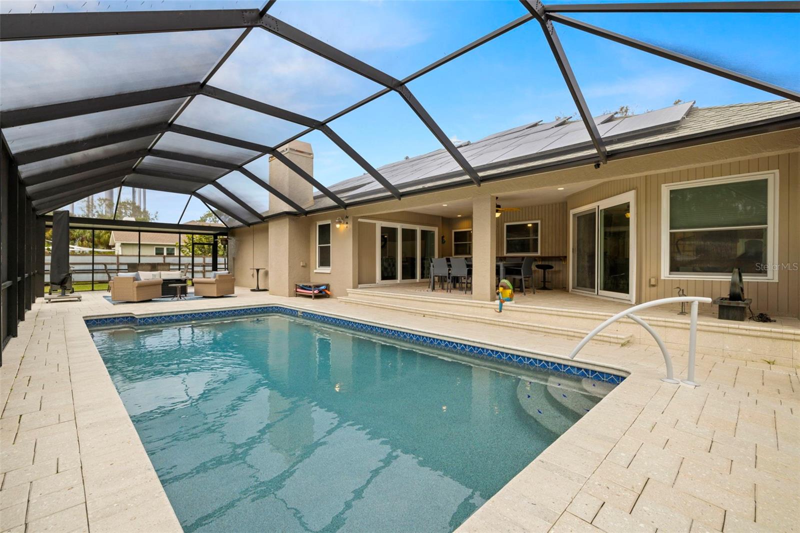 Enjoy your oversized screen pool and lanai area with 2 covered porches and inviting pool.