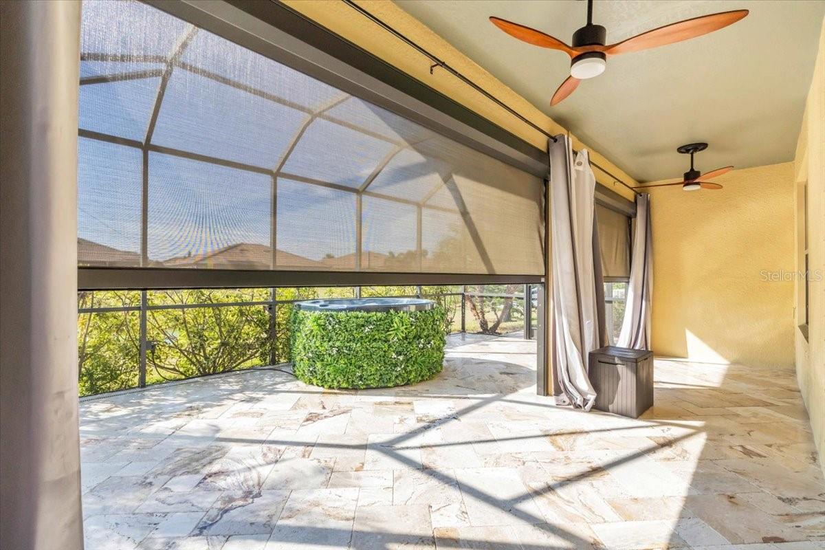 Oversized lanai with Travertine Paver Tiles, Motorized Kevlar Hurricane Screens and Dual Fans on the Lake | 368 Cedar Falls Dr, Apollo Beach, FL  33572