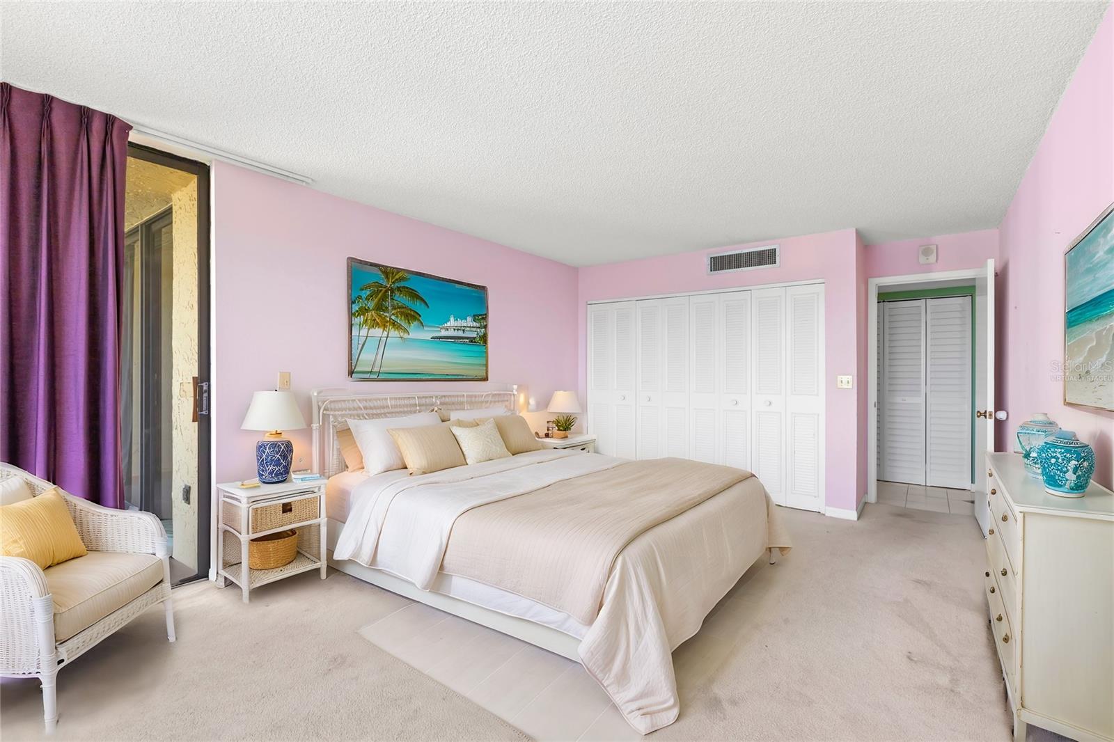 Bedroom #2 has sliders to 2nd balcony and two side-by-side closets joined together. Virtually staged.