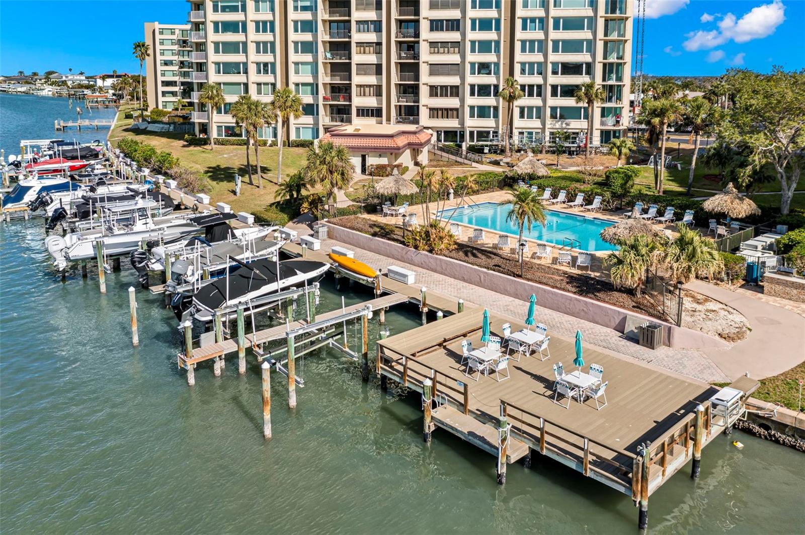 Resort style amenities! Waterfront heated pool, sundeck, fishing pier, outdoor grills and boat slips that are first come first served.