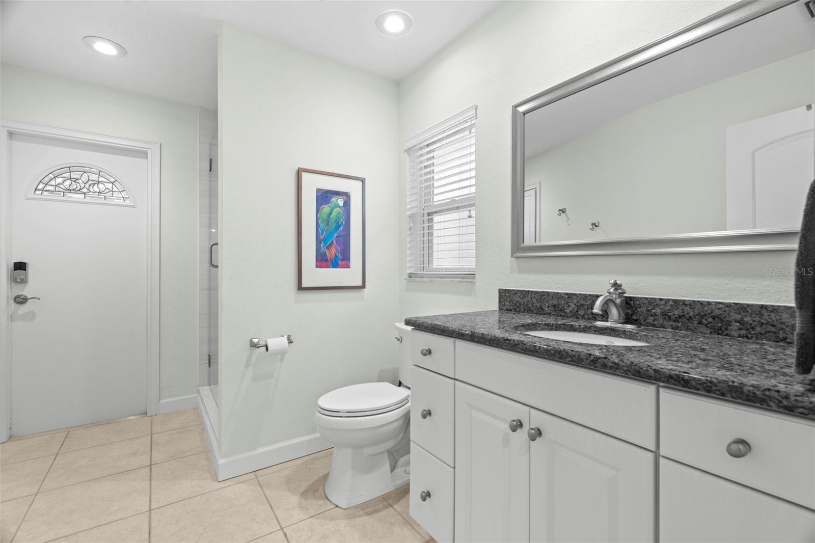 Bathroom with access to the pool.