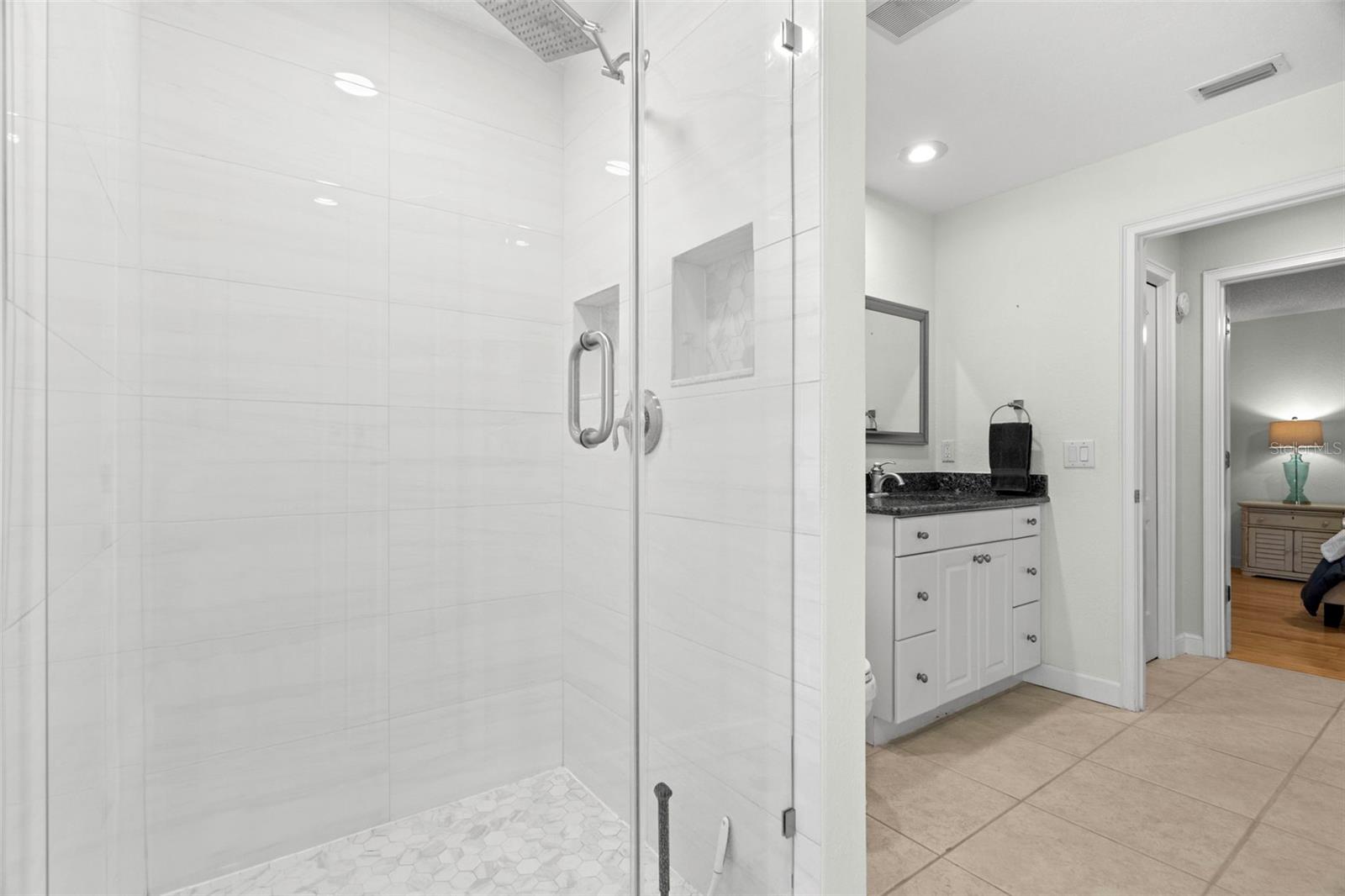 Bathroom with access to the pool.