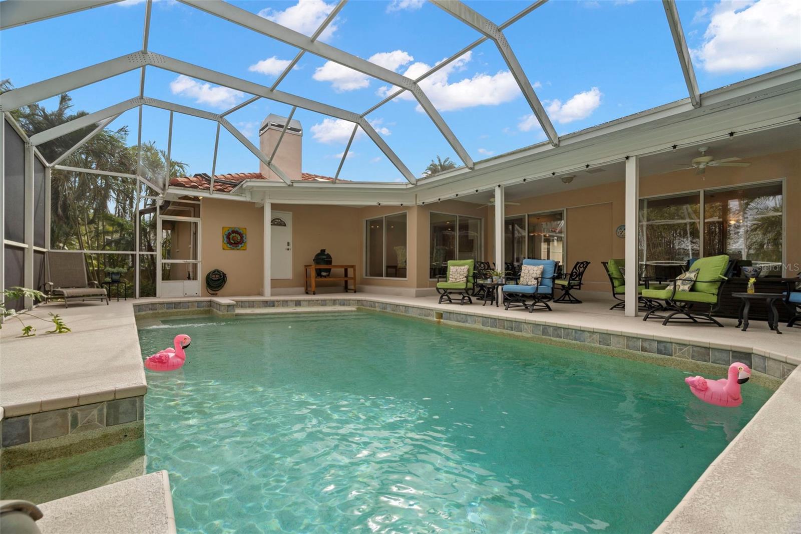 Pool with covered outdoor area for dining al fresco style!