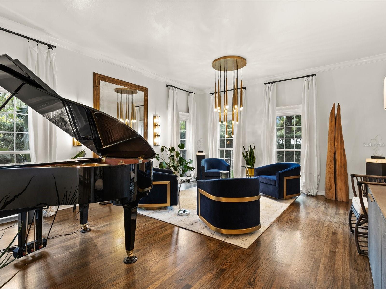 Front Living Room.  High Ceilings with floor to ceiling windows, wood floors.