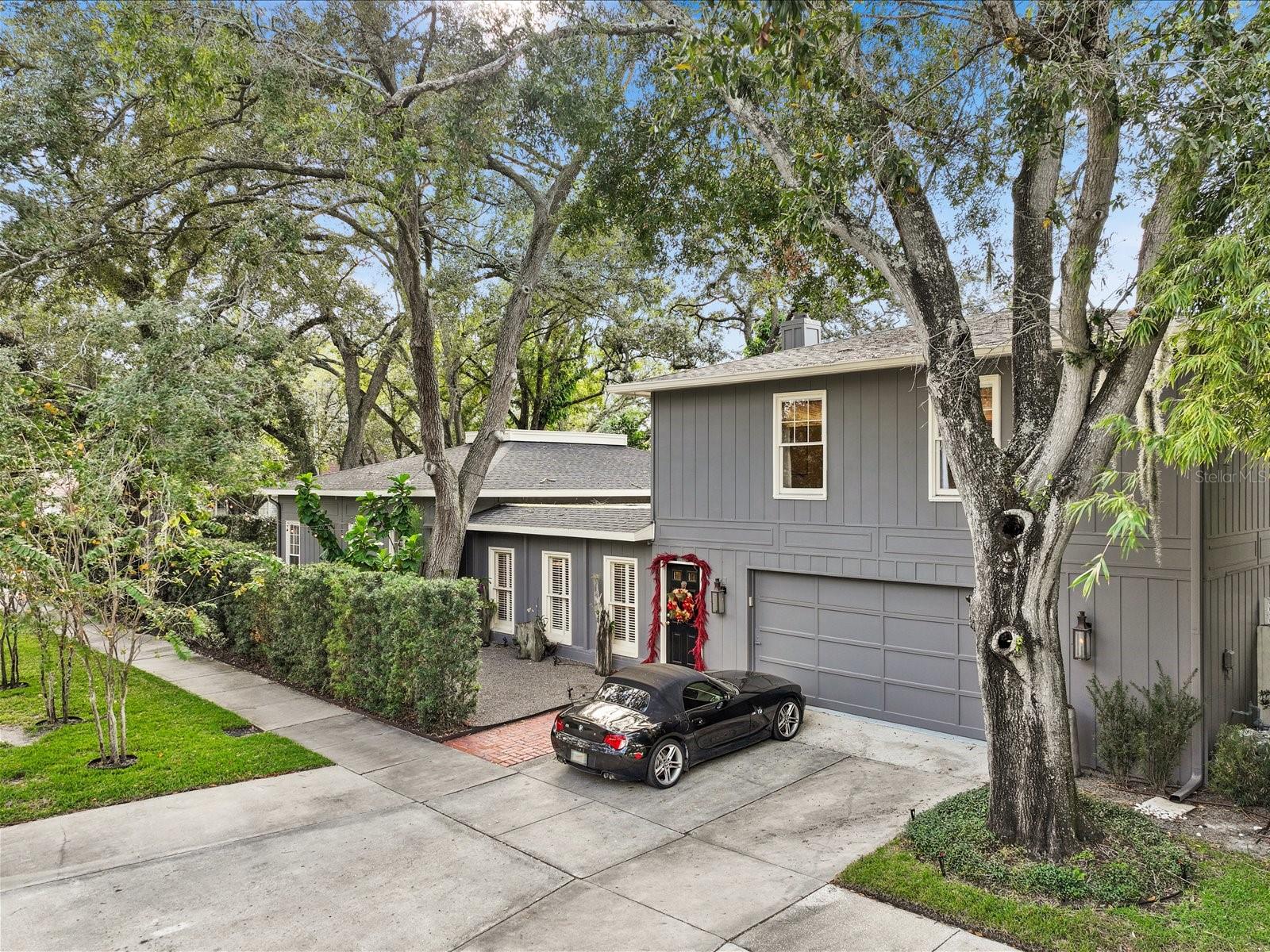 Side yard sits on the West side of Lincoln.  Two car garage with oversized extended driveway.  Side of home facing East includes private side entrance and courtyard.